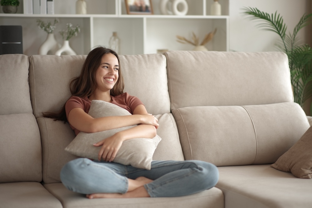 Young woman hugging herself after completing addiction rehab in Sonoma County