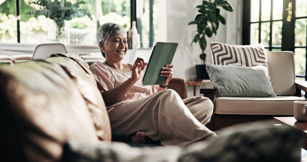 Woman in the living room reading quotes on loving an addict